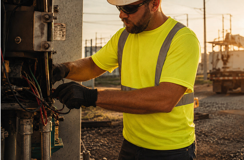 Utility crew wearing high-visibility safety vests during field work
